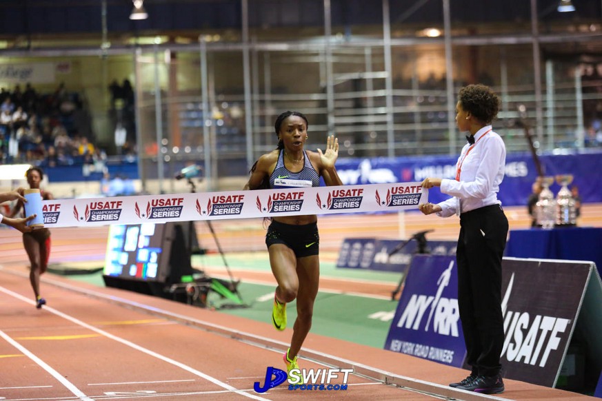 Courtney Okolo crossing the finish line in the 500m.